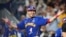 El venezolano Wilson Abraham Ramos celebra después de anotar con un doble de Ramón Flores durante la sexta entrada de un partido de béisbol semifinal de la Serie del Caribe contra Curazao, el jueves 8 de febrero de 2024, en Miami. (Foto AP/Wilfredo Lee)
