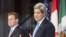 El secretario de Estado John Kerry y el canciller canadiense John Baird (i). 