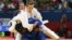 Archivo - La judoca cubana Yurileidys Lupetey Cobas (azul) se enfrenta a la griega Loulietta Boukouvala en los Juegos Olímpicos de Londres 2012.  