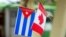 Banderas de Cuba y Canadá.