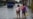 TOPSHOT - Children walk through flooded waters after the passage of hurricane Rafael in Batabano, Artemisa province, Cuba on November 7, 2024.