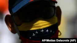 Un manifestante antigubernamental en Venezuela (AP Photo / Matias Delacroix).
