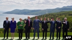 De izq. a der. Donald Tusk; Theresa May; Angela Merkel; Donald J. Trump; Justin Trudeau; Emmanuel Macron; Shinzo Abe; Giuseppe Conte; Jean Claude Juncker.