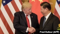 El presidente Donald Trump y el gobernante chino Xi Jinping en Beijing, en noviembre de 2017. (Fred Dufour/AFP).