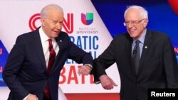 Los aspirantes a la denominación por el Partido Demócrata: el exvicepresidente Joe Biden y el el senador por Vermont Bernie Sanders.