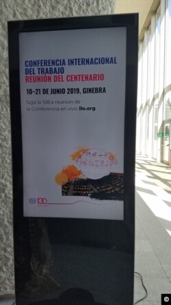 Uno de los carteles en la sede de la 108 Conferencia de la OIT en Ginebra.