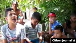 Reporta Cuba. Niños durante una acción del proyecto "Nuevas Manos" en Santiago de Cuba.