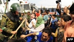 Enfrentamiento de la policía China contra uigures.