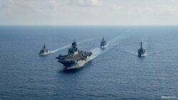 Barcos de guerra de Estados Unidos y Australia navegan por el mar de la China Meridional el 18 de abril de 2020. Foto: Archivo/Petty Officer 3rd Class Nicholas Huynh/U.S. Navy/Mancomunada via REUTERS.