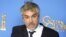 Alfonso Cuaron con el Golden Globe a la mejor dirección. 