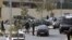 Efectivos de la Policía Nacional, durante la operación llevada a cabo desde la madrugada en Ceuta contra el terrorismo islamista y en la que han sido detenidas dos personas.