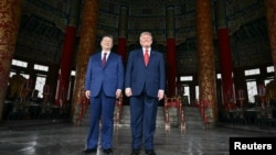 El presidente Donald Trump junto al primer mandatario chino Xi Jinping.