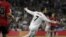 El delantero portugués del Real Madrid Cristiano Ronaldo celebra tras marcar ante Osasuna, durante el partido de Liga en Primera División que se disputó esta tarde en el estadio Santiago Bernabéu, en Madrid.