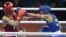 El cubano Robeisy Ramirez (azul) ante el mongol Tugstsogt Nyambayar en el combate de boxeo categoría de peso mosca 52 kgs de los Juegos Olímpicos de Londres 2012, en Londres, Inglaterra.