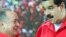 El presidente venezolano, Nicolás Maduro (d), y el presidente de la Asamblea Nacional, Diosdado Cabello (i), en un acto del "Gobierno de Calle" en Caracas.