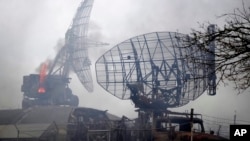 Damaged radar arrays and other equipment is seen at Ukrainian military facility outside Mariupol, Ukraine, Thursday, Feb. 24, 2022.