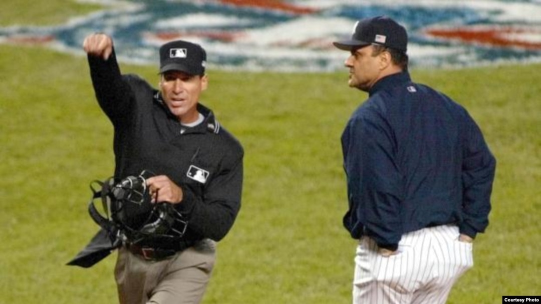 Angel Hernandez y Joe Torres