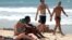 Turistas extranjeros disfrutan de un día de mar en las playas del este de La Habana.