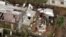 Vista aérea de familias en labores de recuperación  después del paso del huracán Ike sobre Pinar del Río. Archivo.