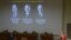 Una pantalla muestra las fotografías de los científicos estadounidenses (de izda a dcha) Randy W. Schekman y James E. Rothman así como la del alemán Thomas C. Südhof mientras se anuncian sus nombres como ganadores del Nobel de Medicina 2013.  