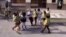 Agentes del MININT y la policía detienen a Berta Soler y otras dos Damas de Blanco frente a la sede del grupo opositor en Lawton, La Habana, en octubre del 2019.