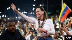 Venezuelan opposition leader and Nobel Peace Prize laureate Maria Corina Machado greets supporters upon her arrival in Caracas on October 25, 2026.