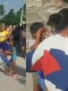 La familia de Bárzaga Mompié lo esperó con una bandera cubana.