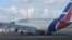 La aerolínea estatal dice que las empresas proveedoras en el país suramericano se han negado a suministrarle combustible.