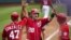 Jayson Werth, de los Nacionales, es recibido en home por sus compañeros, entre ellos el cubanoamericano nacido en Hialeah Gio González